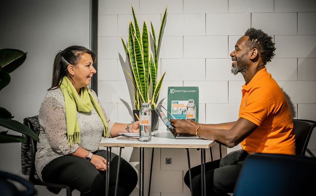 Advisor and client during a walk in advice centre at the Oxford Street pop-up
